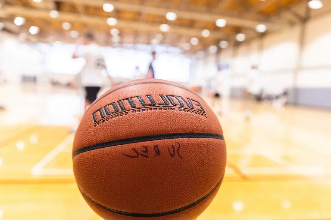 Basketball sitting on the court.